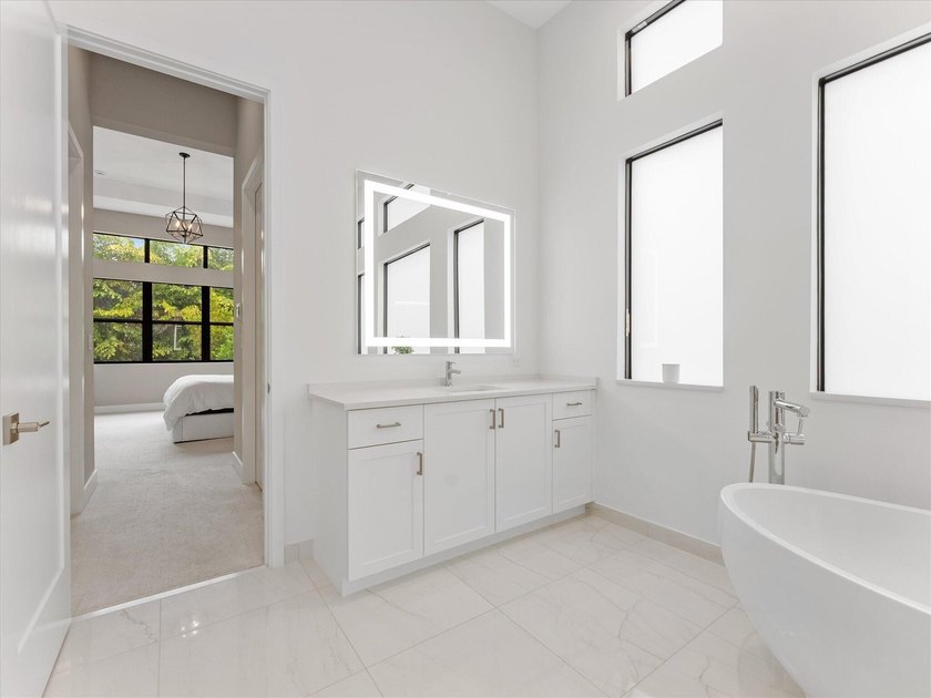 Welcome to this stunning 2025 built home in Lotus Edge, set on - photo 17