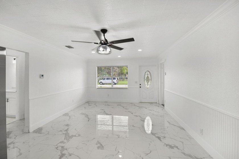 Fully renovated 3-bedroom, 2-bath home featuring a desirable - photo 4