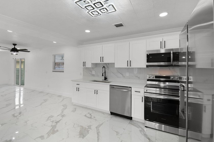 Fully renovated 3-bedroom, 2-bath home featuring a desirable - photo 9