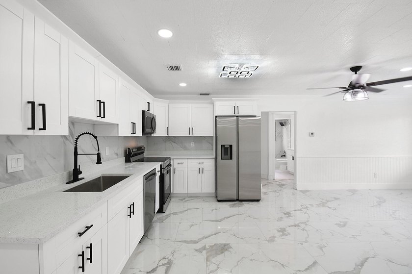 Fully renovated 3-bedroom, 2-bath home featuring a desirable - photo 10