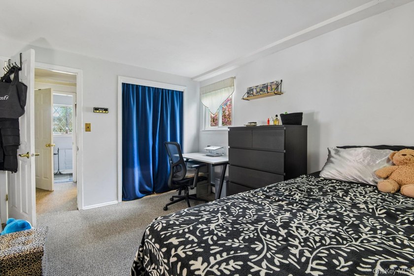 Welcome to this spacious 4-bedroom, 1.5-bath high ranch nestled - photo 31