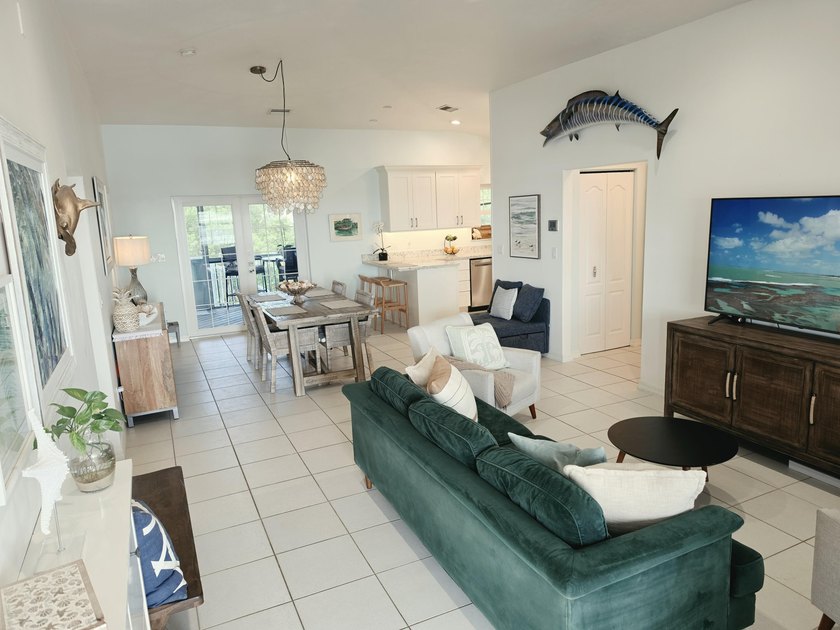 Elevated Coastal Living in Breezeswept Beach Estates. Skip the - photo 3