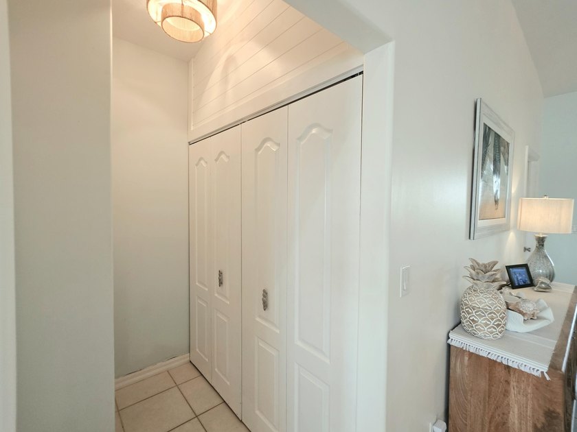 Elevated Coastal Living in Breezeswept Beach Estates. Skip the - photo 9
