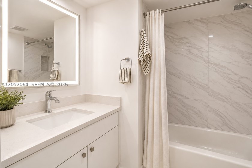 Welcome to this beautifully renovated first-floor condo in the - photo 12