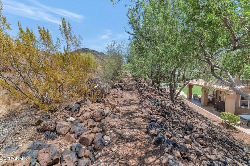 Tucked away on nearly 3/4 of an acre in the prestigious - photo 47