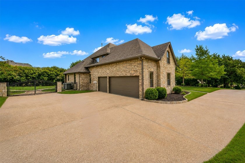Nestled within the prestigious gated neighborhood of The - photo 2