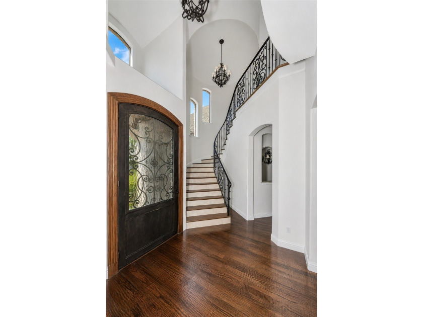 Nestled within the prestigious gated neighborhood of The - photo 3