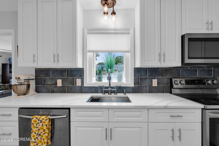 Brick's highly desirable Lake Riviera offers this expanded 3 - photo 7