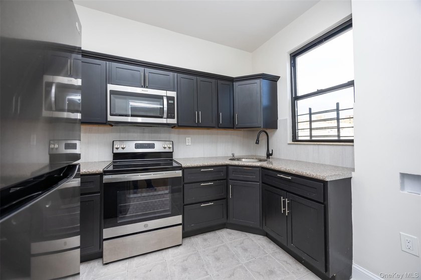 Fully Renovated Three-Family Homes - Strong Investment - photo 8