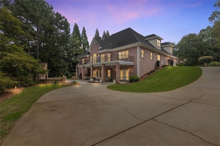 This exquisite four-sided blush brick estate is the epitome of - photo 5