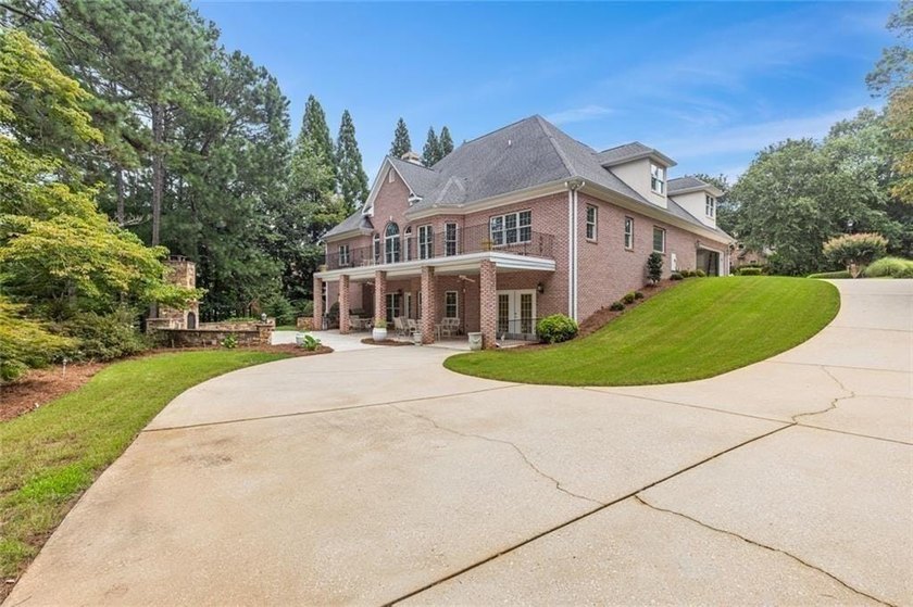 This exquisite four-sided blush brick estate is the epitome of - photo 6