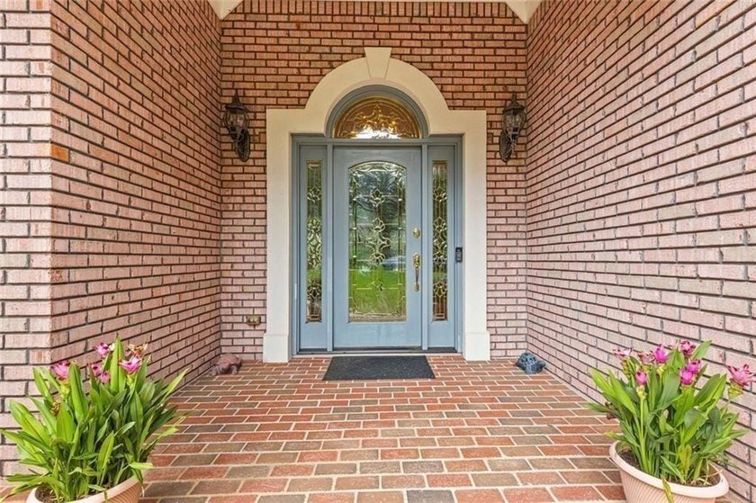 This exquisite four-sided blush brick estate is the epitome of - photo 7