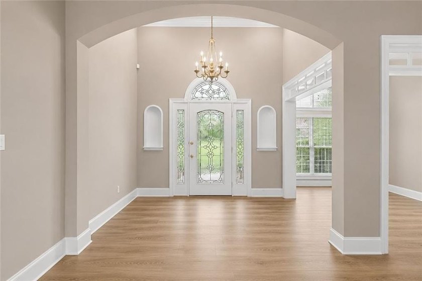 This exquisite four-sided blush brick estate is the epitome of - photo 10