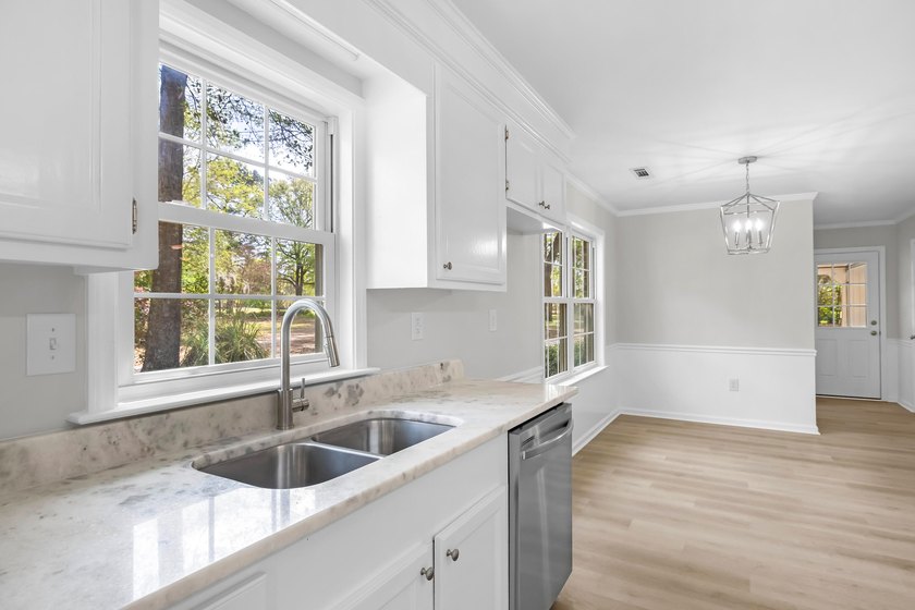 TOTALLY RENOVATED, ALL NEW KITCHEN, FRESH PAINT, NEW FLOORING - photo 11