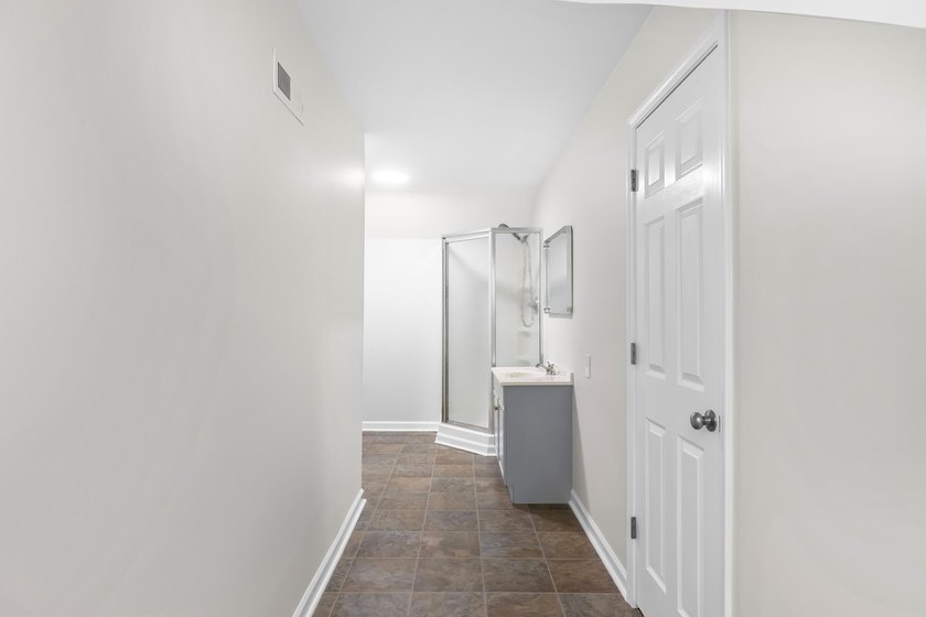 TOTALLY RENOVATED, ALL NEW KITCHEN, FRESH PAINT, NEW FLOORING - photo 18
