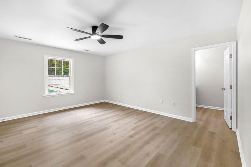TOTALLY RENOVATED, ALL NEW KITCHEN, FRESH PAINT, NEW FLOORING - photo 23
