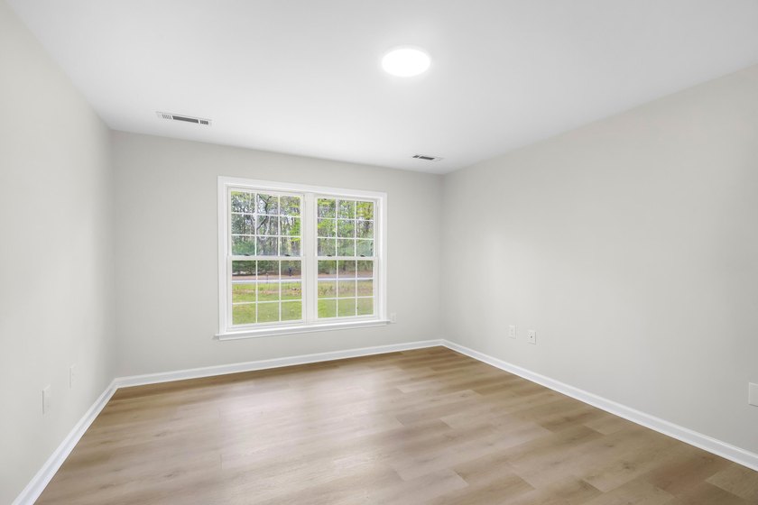 TOTALLY RENOVATED, ALL NEW KITCHEN, FRESH PAINT, NEW FLOORING - photo 30