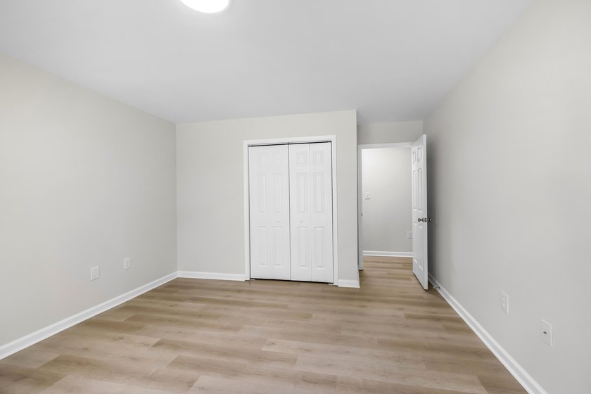 TOTALLY RENOVATED, ALL NEW KITCHEN, FRESH PAINT, NEW FLOORING - photo 31