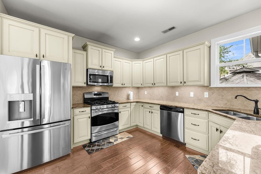Nestled on a desirable corner lot, this beautiful two-story home - photo 4