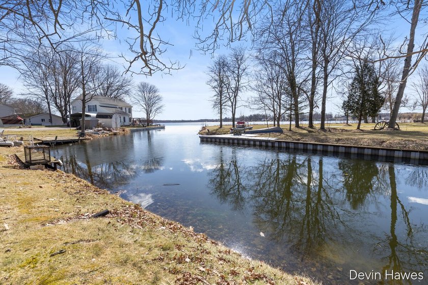 Tucked along 64 feet of private channel frontage with direct - photo 10