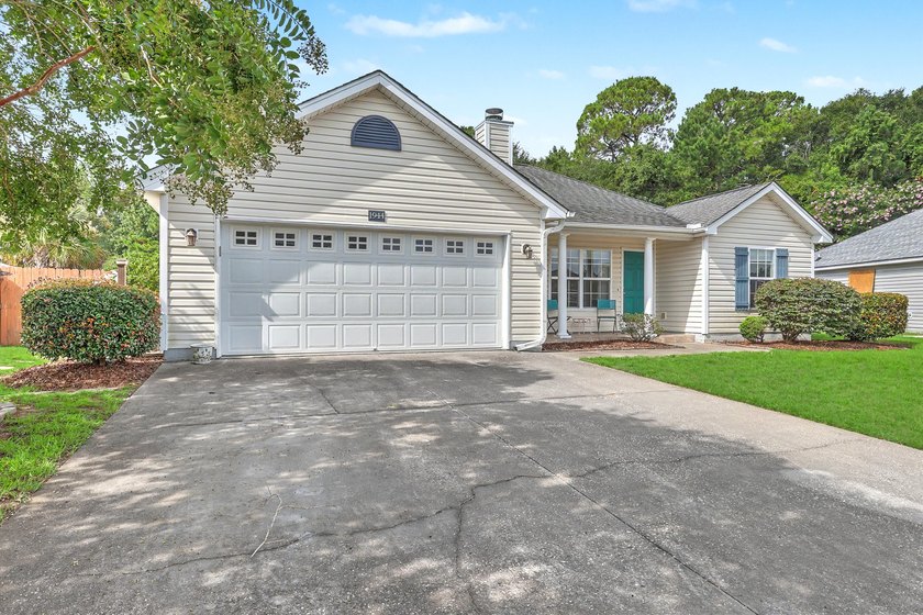 Nestled on a prime corner lot with serene pond views, this - photo 3