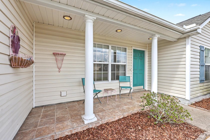 Nestled on a prime corner lot with serene pond views, this - photo 4