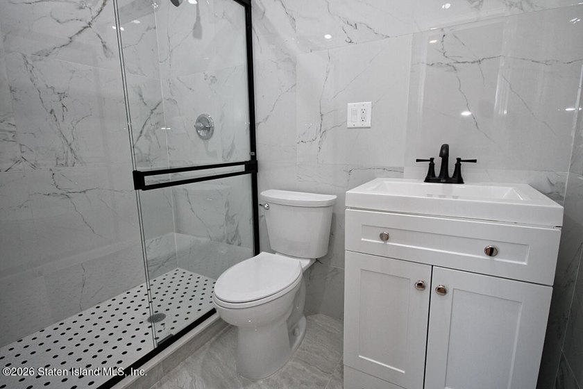 *New Construction* Stunning Two Family detached house with 9ft - photo 11