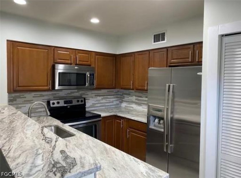Remodeled &amp; Move-In Ready - Largest Unit in the Complex! - photo 2