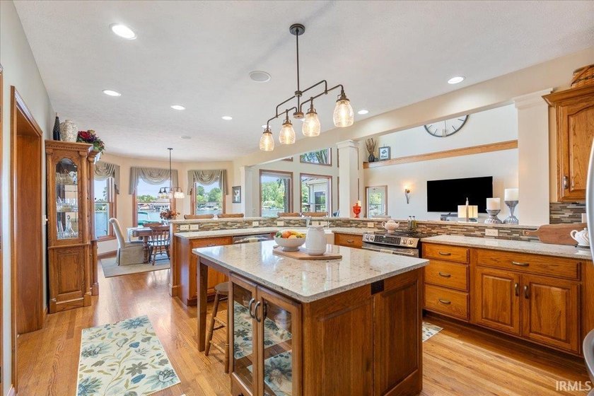 Experience exceptional lakefront living in this custom-built - photo 3