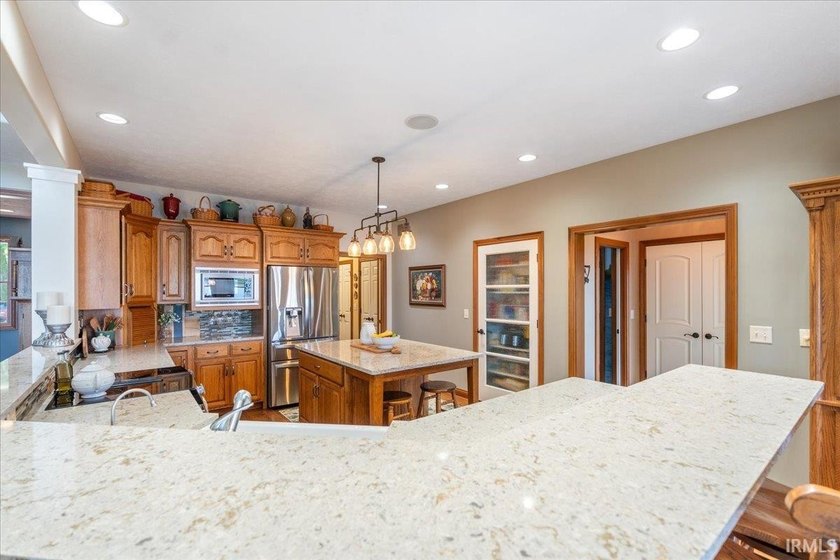 Experience exceptional lakefront living in this custom-built - photo 4