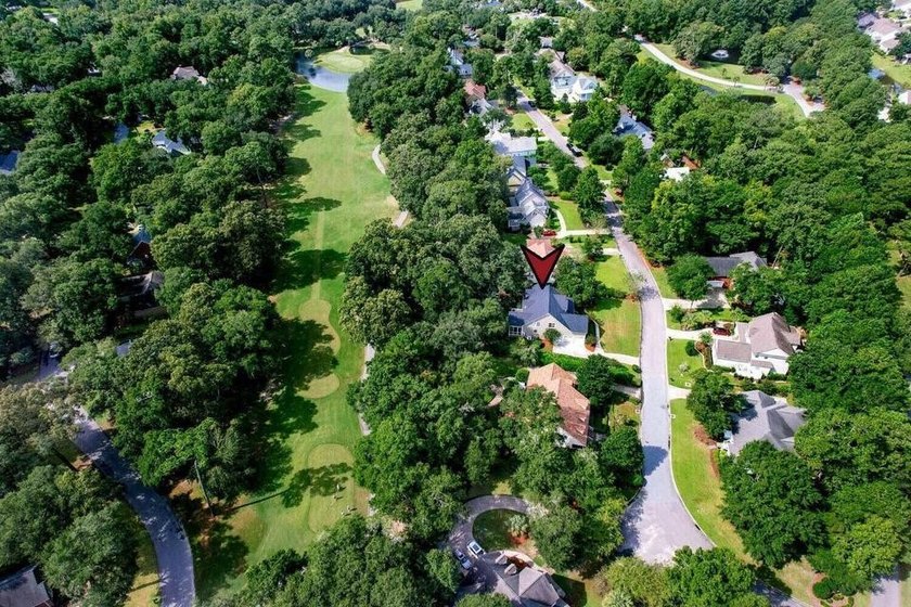 Situated on over a third of an acre on the 18th hole in the - photo 2