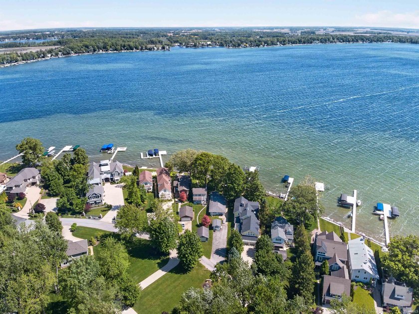 The value is in the setting-53 feet of Lake Wawasee frontage, a - photo 9