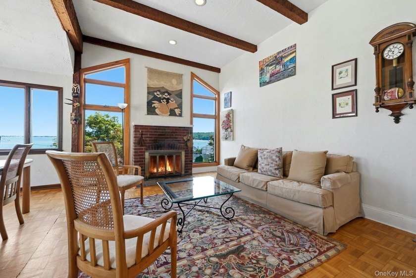Nestled into the hillside with water views that hold through - photo 6