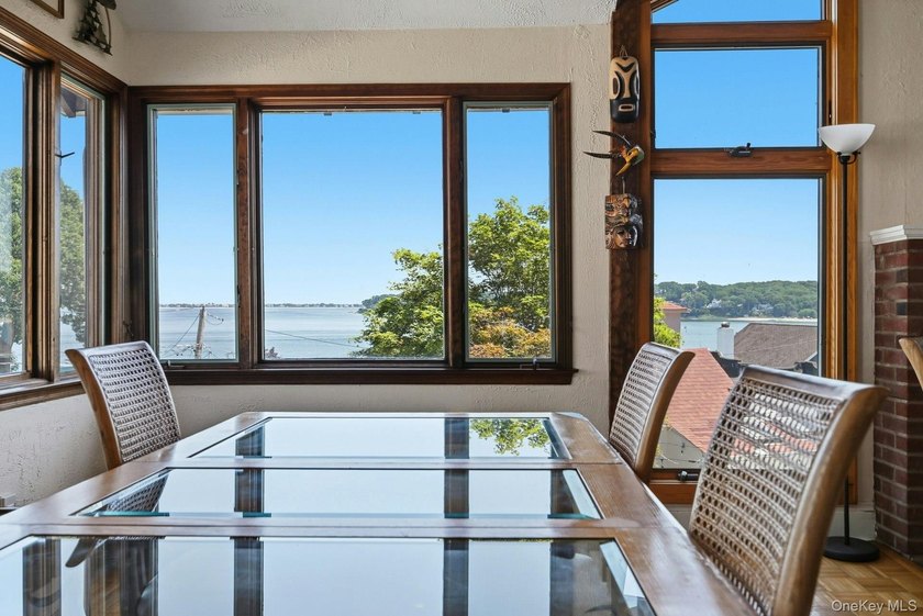 Nestled into the hillside with water views that hold through - photo 8