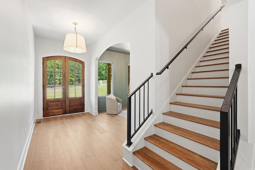 Nestled on a beautifully private homesite in the highly - photo 7