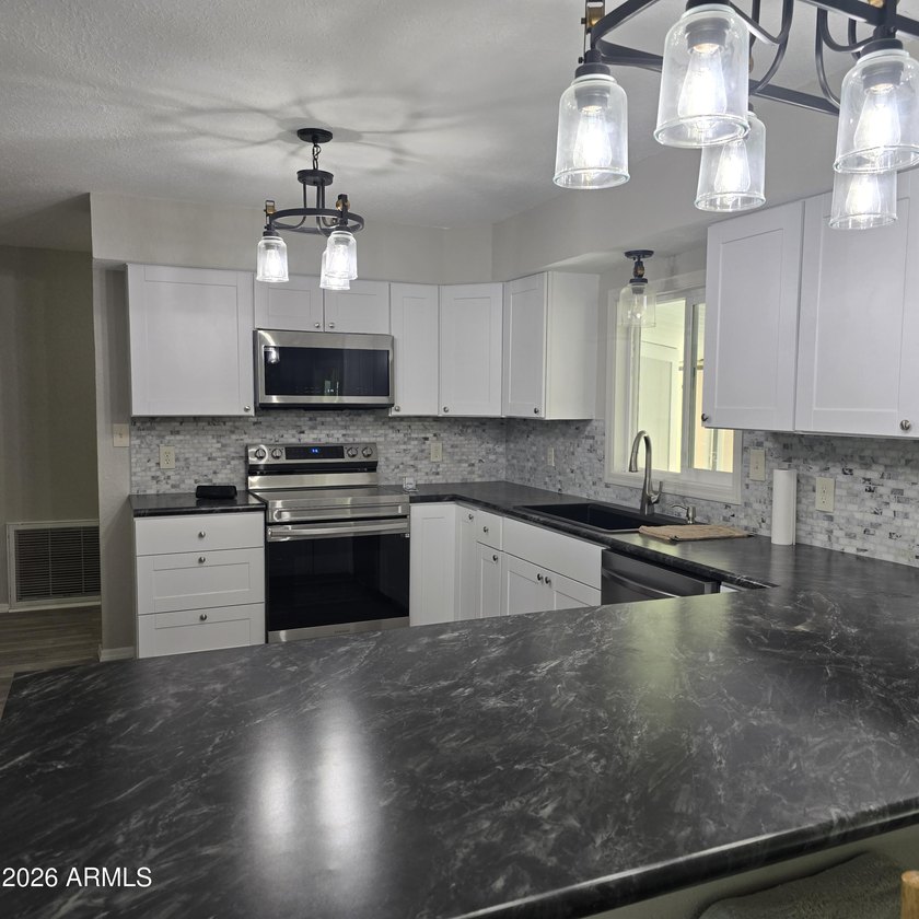 ON LEASED LAND: This home is absolutely gorgeous!! It has been - photo 2