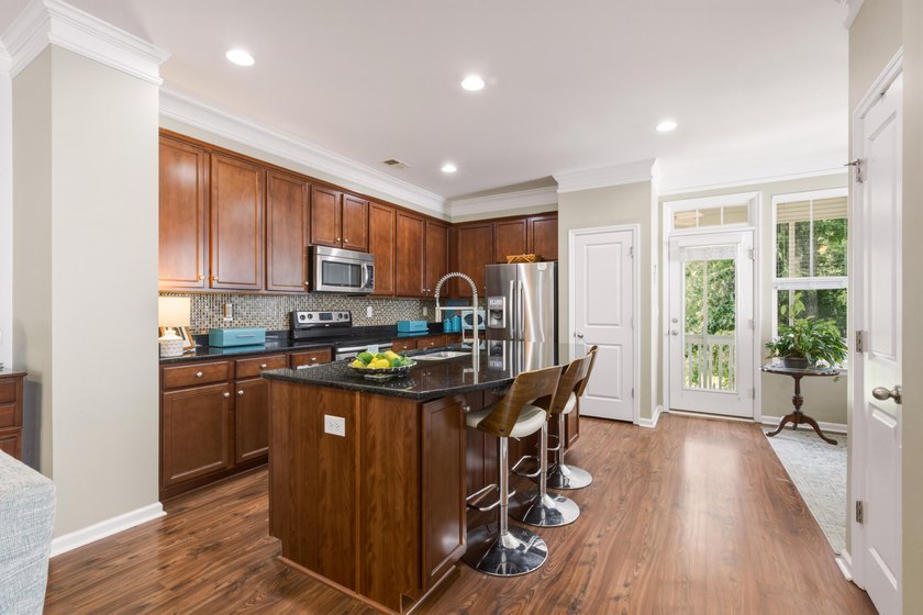 Welcome to this sophisticated and coveted end-unit townhome in - photo 9