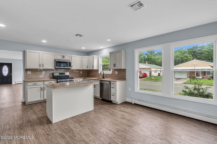 Welcome to 2 Ashcroft Lane, a charming 2-bed, 2-bath Lakeview - photo 9