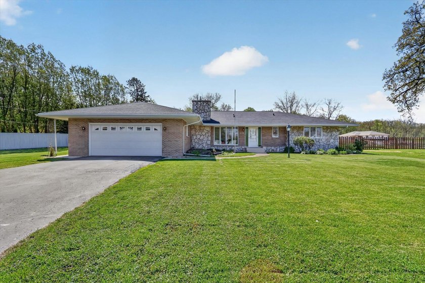 All-brick home offering space and comfort throughout! Features a - photo 2