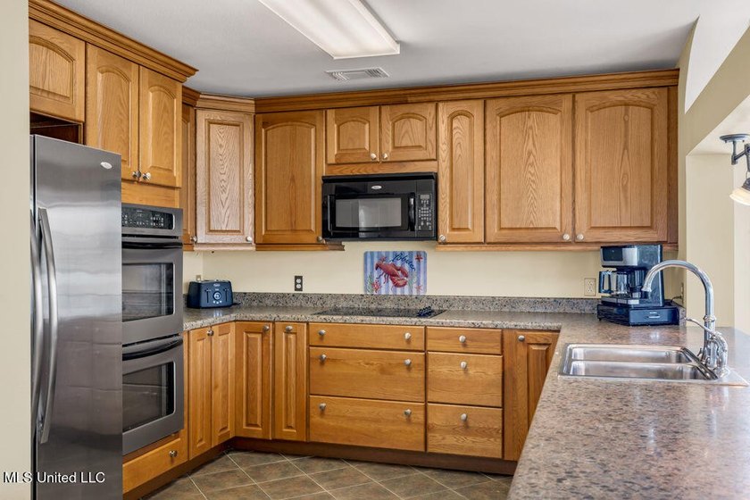 Located on a spacious waterfront lot in Bay St. Louis, this - photo 16