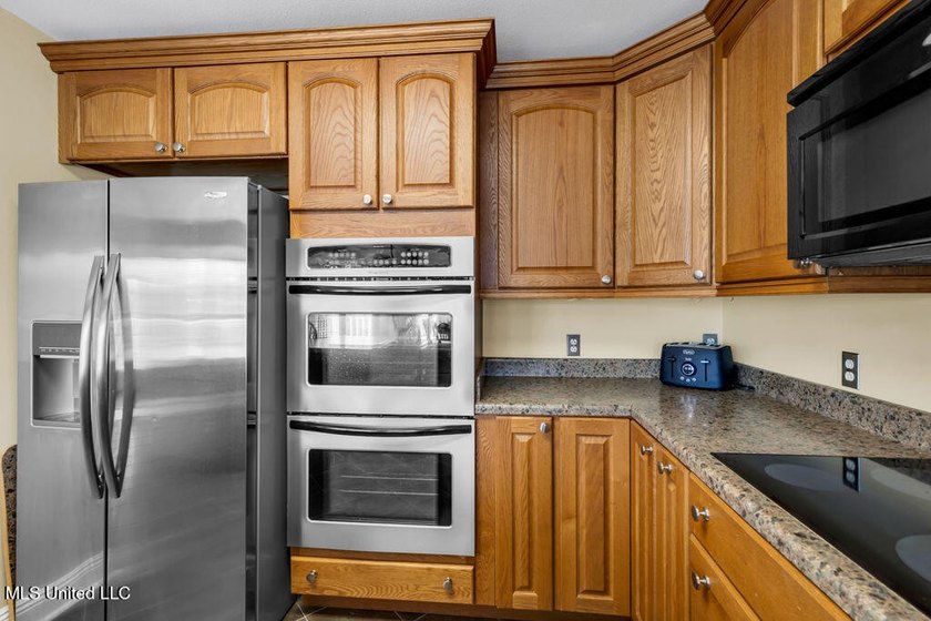 Located on a spacious waterfront lot in Bay St. Louis, this - photo 17