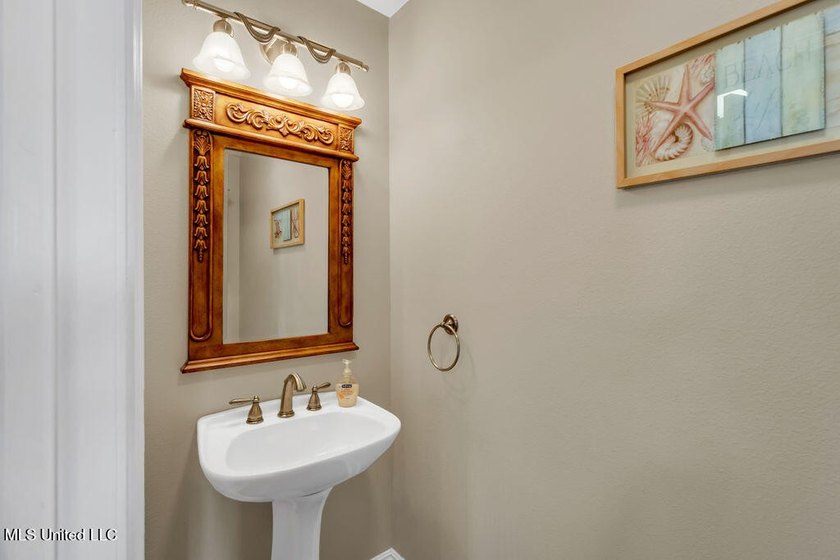 Located on a spacious waterfront lot in Bay St. Louis, this - photo 20