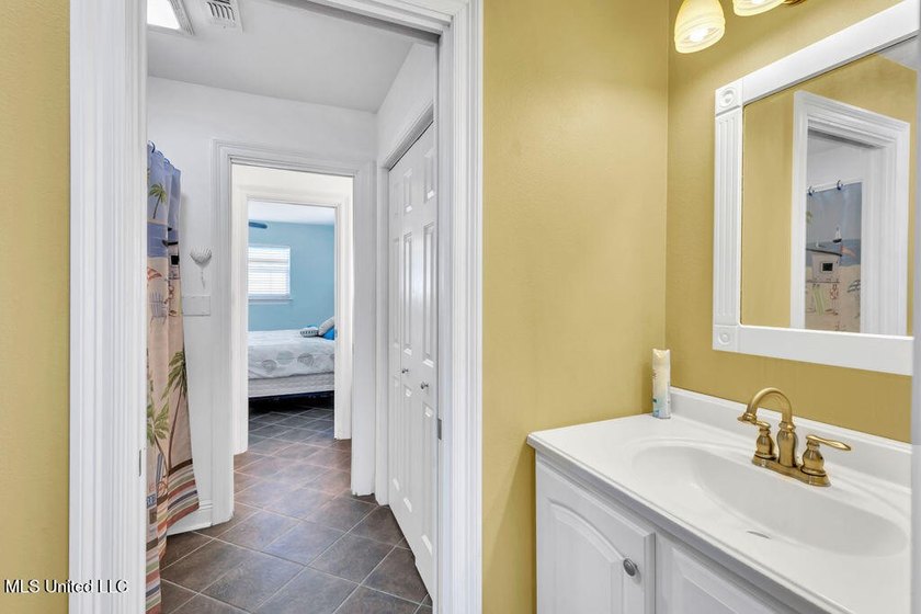 Located on a spacious waterfront lot in Bay St. Louis, this - photo 25