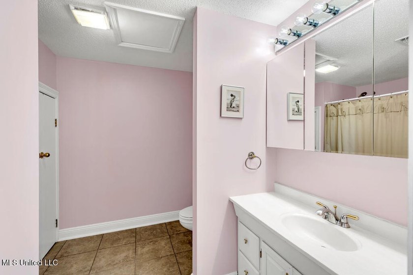 Located on a spacious waterfront lot in Bay St. Louis, this - photo 34