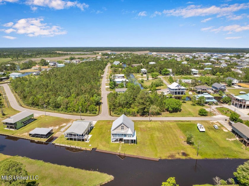 Located on a spacious waterfront lot in Bay St. Louis, this - photo 39