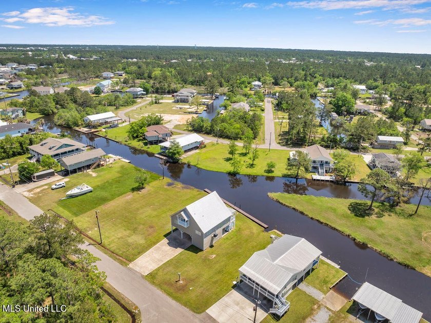 Located on a spacious waterfront lot in Bay St. Louis, this - photo 41