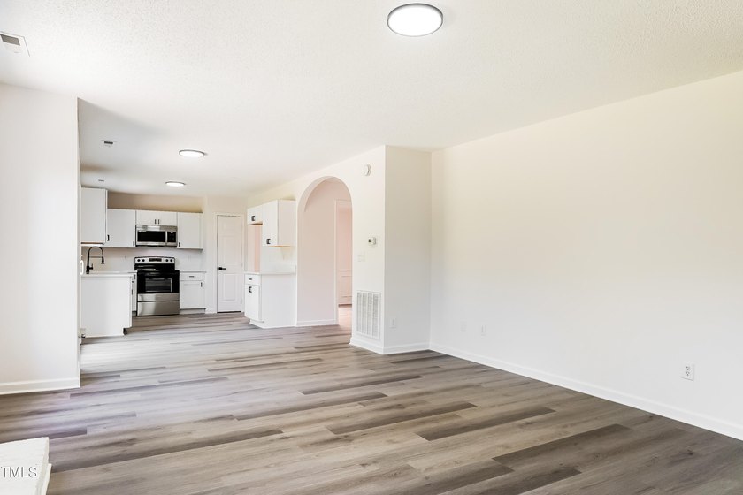 This fully refreshed 4-bedroom, 2.5-bath home with a 2-car - photo 3