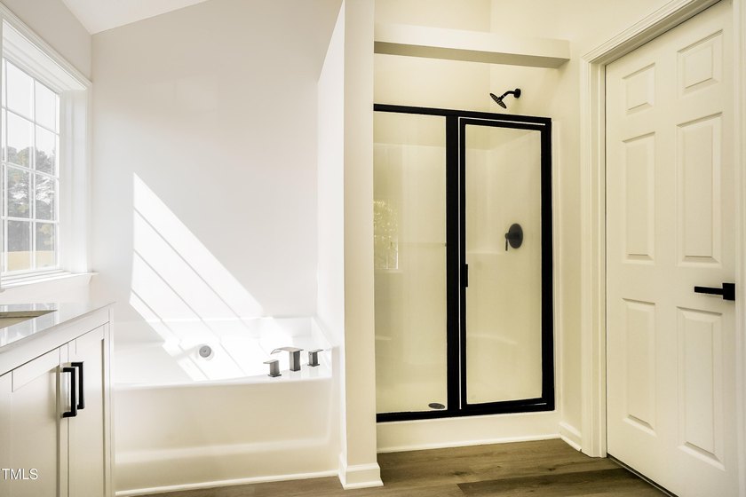 This fully refreshed 4-bedroom, 2.5-bath home with a 2-car - photo 9