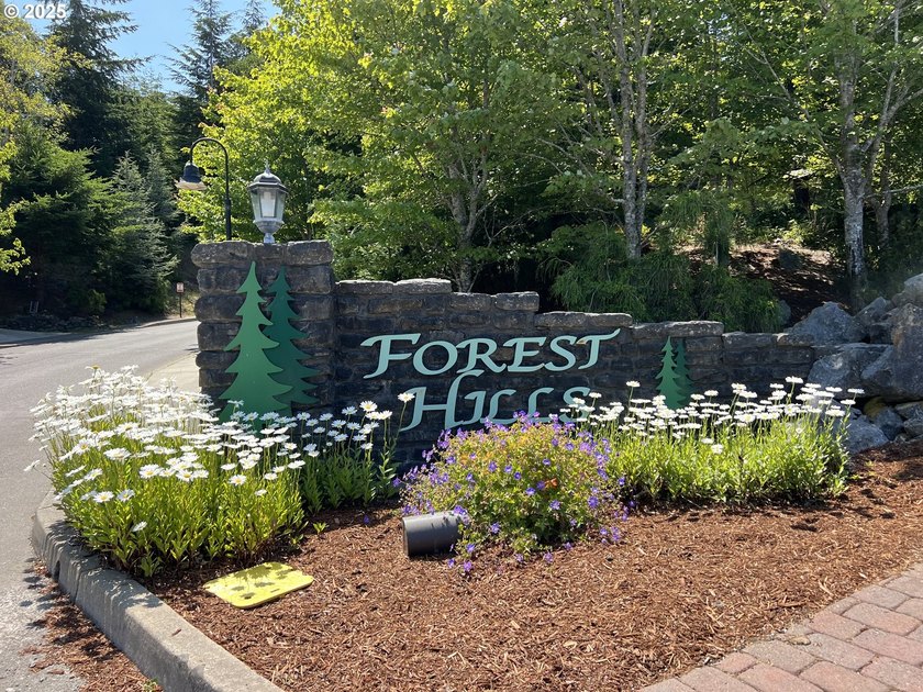 Surrounded by towering trees and quality custom homes, this - photo 6