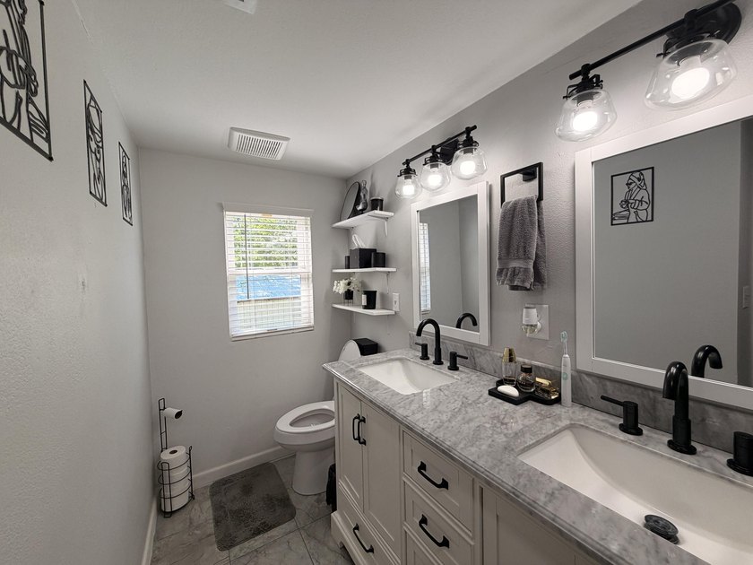 Completely remodeled and move-in ready, this quaint home blends - photo 8